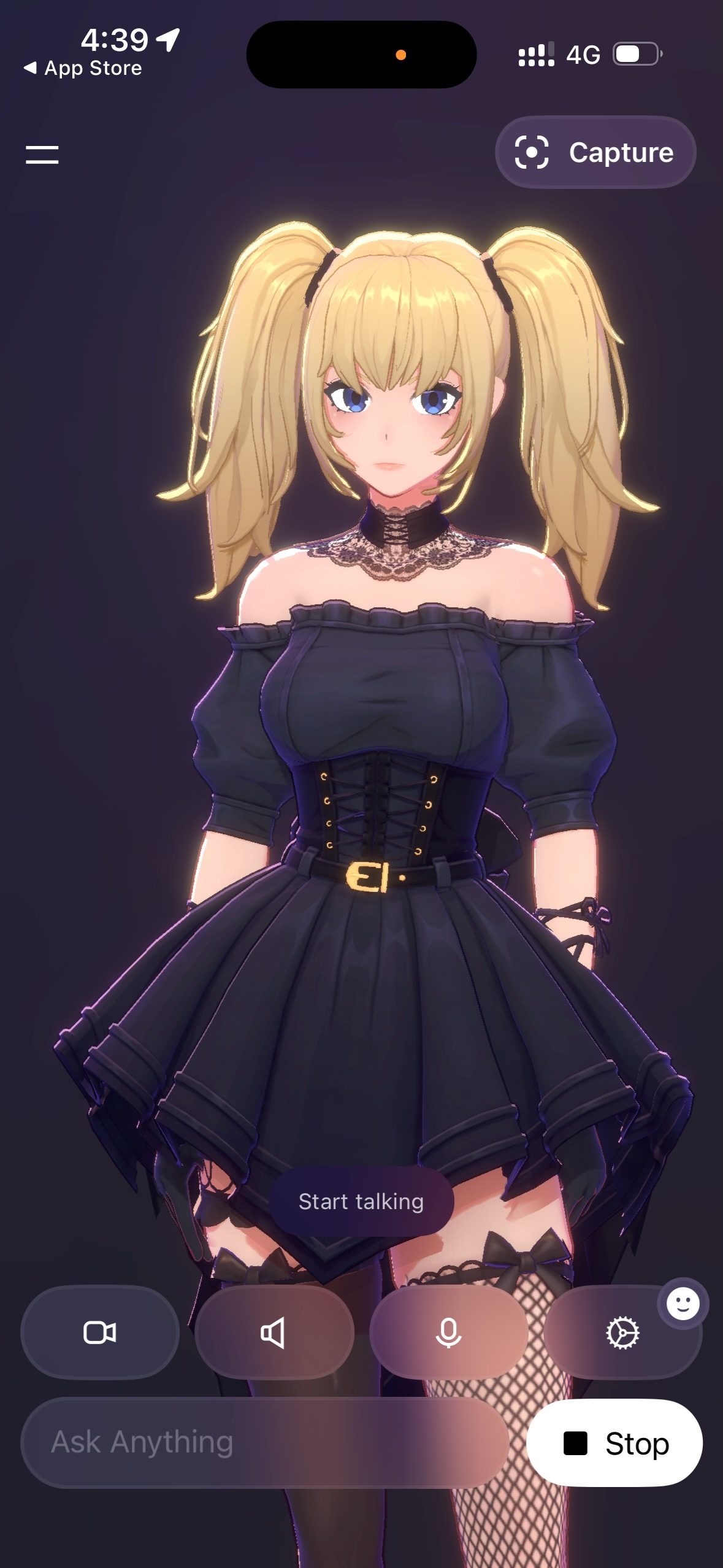 スマホアプリ Grok の Ani。金髪ツインテールに黒いゴシック調ドレスの3Dキャラクターと、下部に「Start talking」ボタン